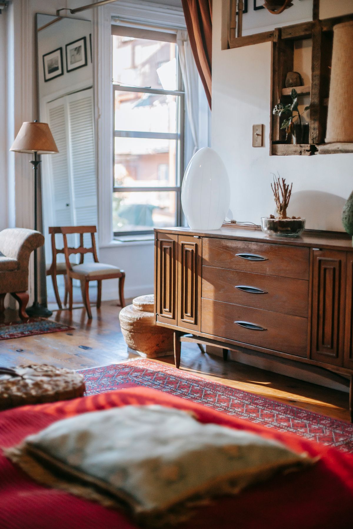 Layered cushions and throws on a sofa